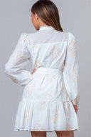 White lace dress with long sleeves on a gray background
