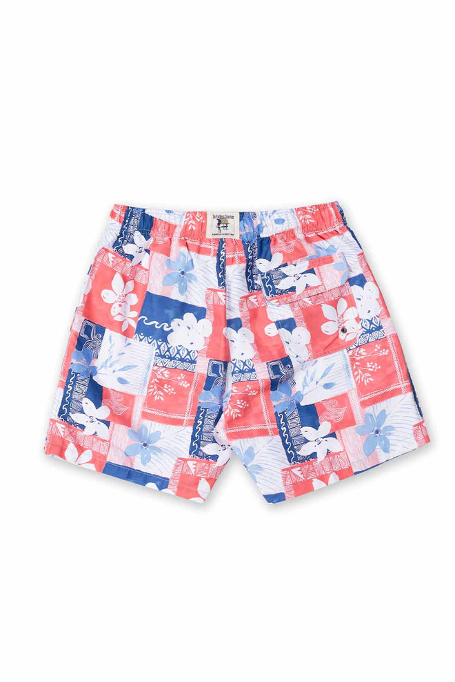 Patchwork shorts with floral and abstract patterns on a white background