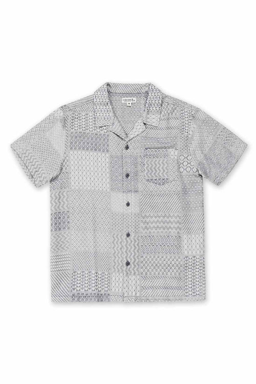 Short-sleeve patterned shirt on a white background