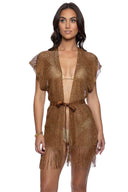 Woman wearing a gold fringe dress on a white background