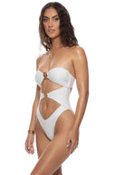 Woman wearing a white cut-out swimsuit on a white background
