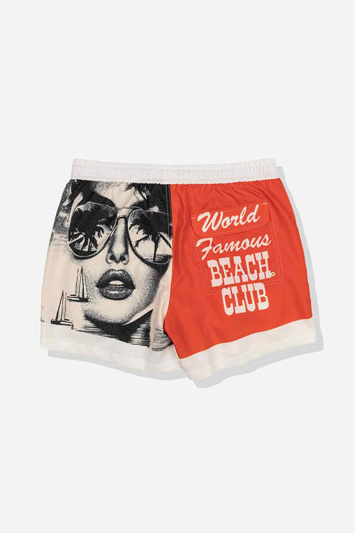 Shorts with a graphic design of a woman's face and 'World Famous Beach Club' text on a white background
