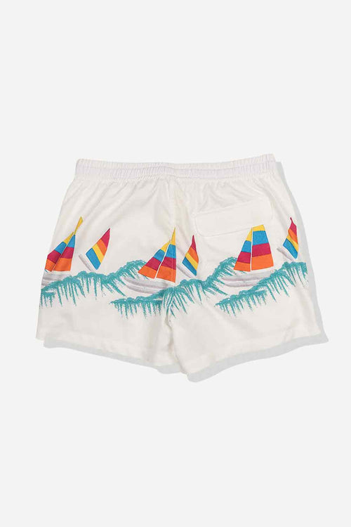 White shorts with colorful sailboat design on a white background