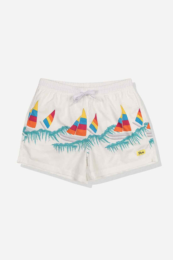 White shorts with colorful sailboat design on a white background