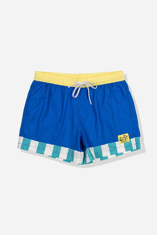 Blue swim shorts with yellow waistband and striped hem on a light gray background