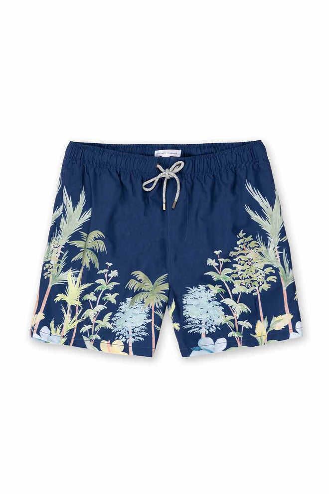 Navy blue swim shorts with tropical palm tree and animal print on a white background
