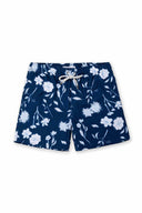 Navy blue swim shorts with white floral pattern on a white background